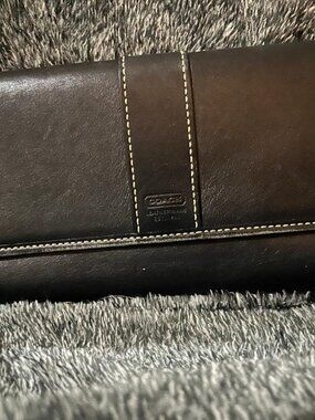 This is a black Coach Hampton wallet